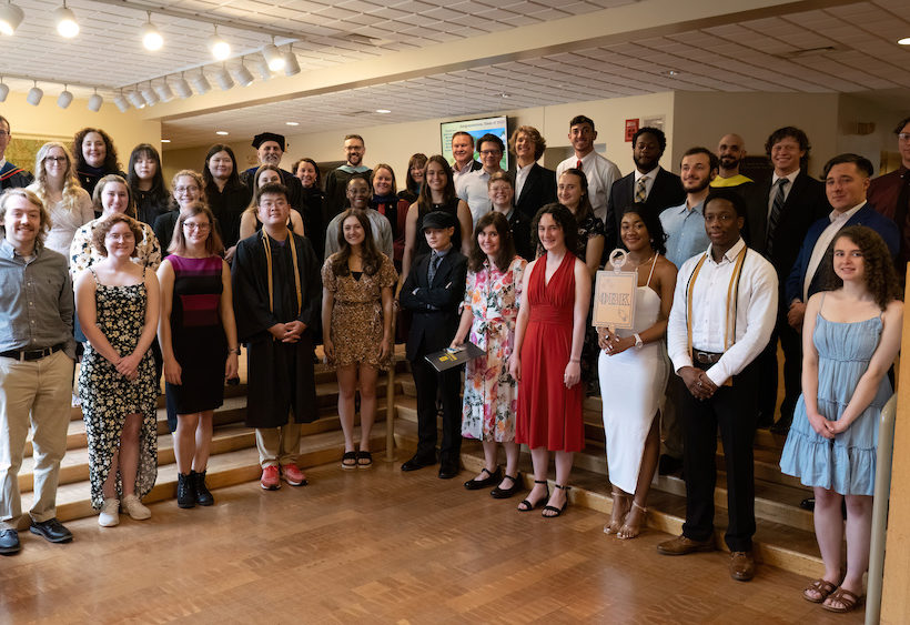 2023 PBK Inductees with Faculty and Staff smiling at the camera in Scheide Music Center