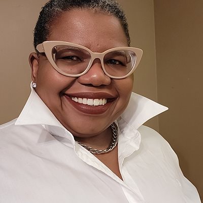 headshot of Tammy L. Kernodle, a woman wearing glasses and smiling