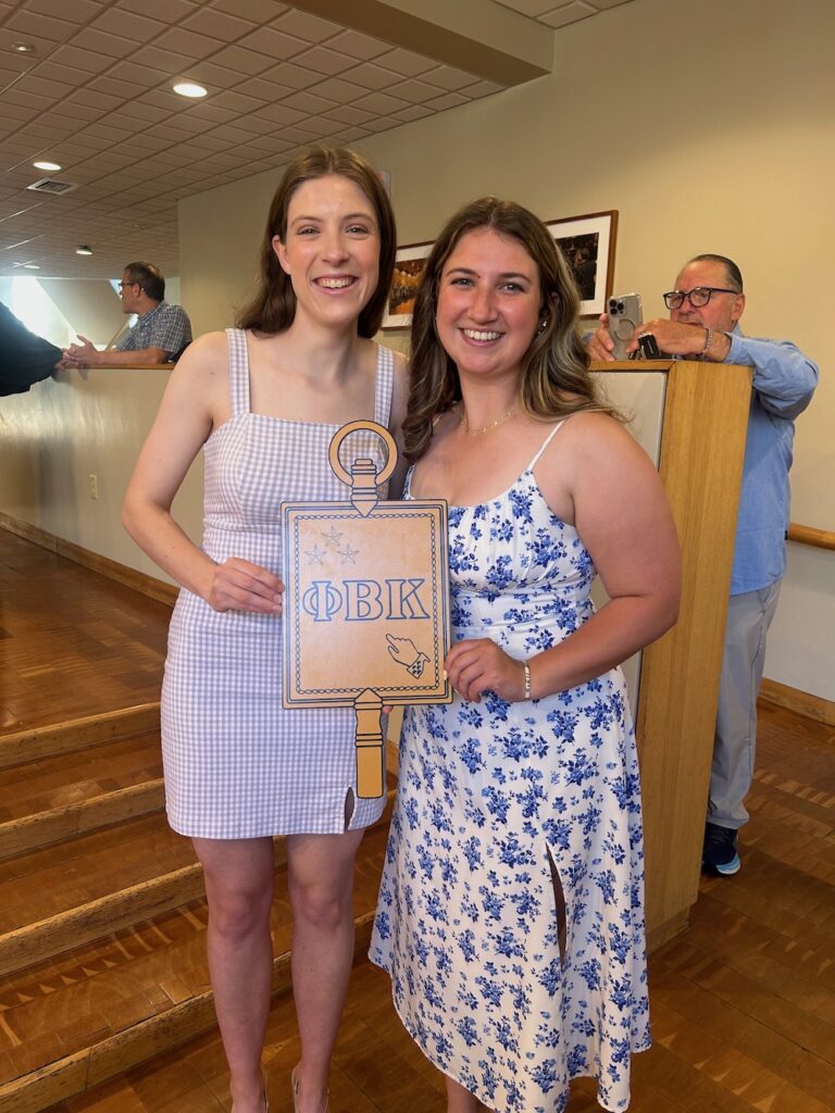 two 2025 Inductees holding the PBK key smile at the camera in Scheide Music Center