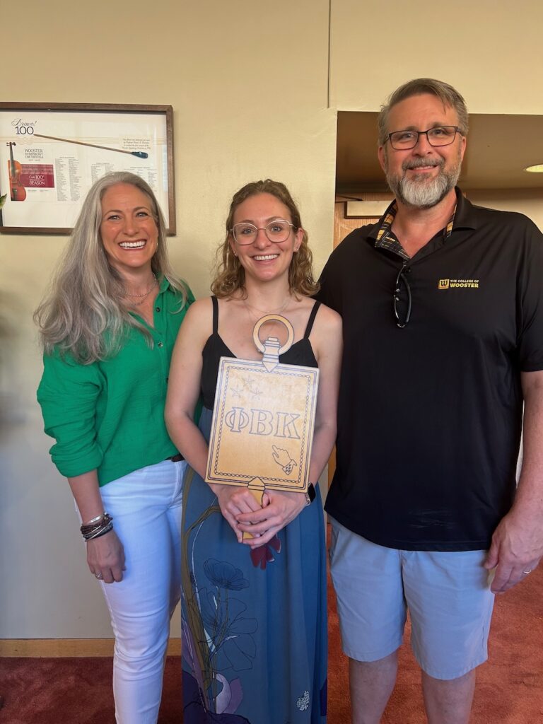 a 2025 PBK Inductee and family smile at the camera in Scheide Music Center