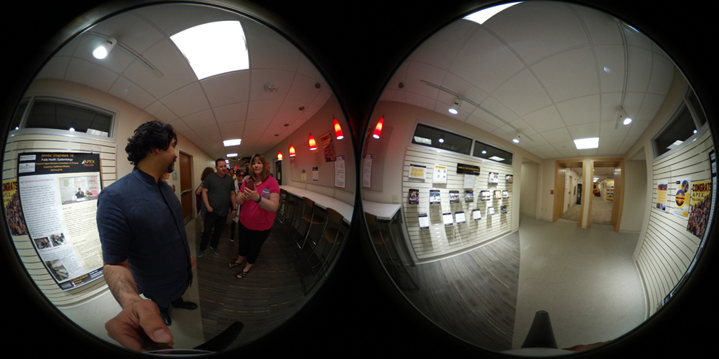 360 image of people walking down a hall