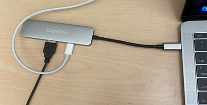 Image of MacBook Pro with dongle attached